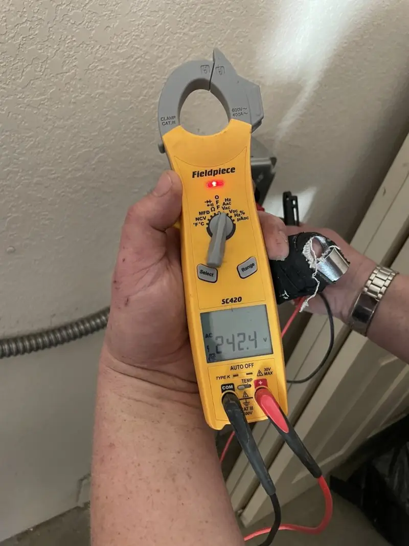Voltage testing with clamp meter during Generator Installation in Horseshoe Bay